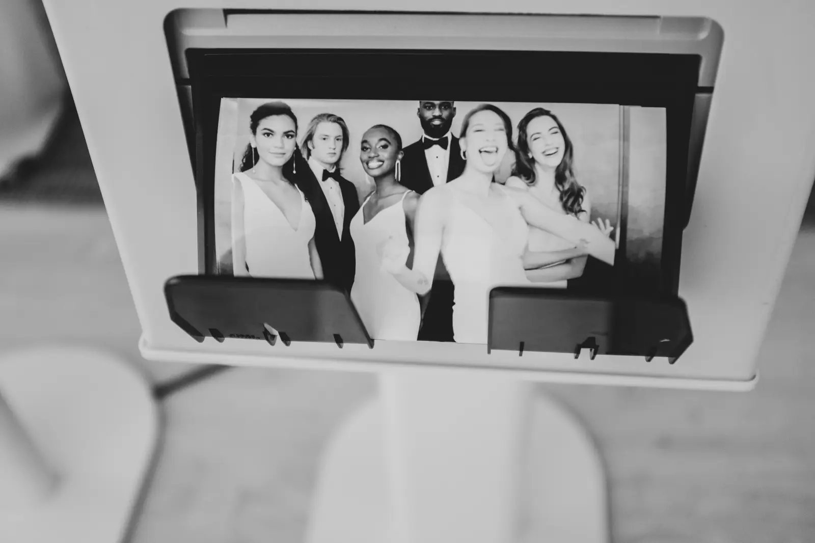 Black and white Fiesta Booth photo displayed on a screen