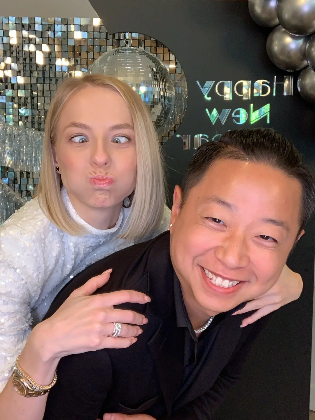 Guests taking a playful selfie at a branded celebration